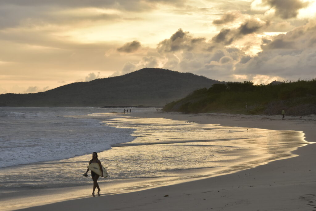 surfing in puerto villamil galápagos 